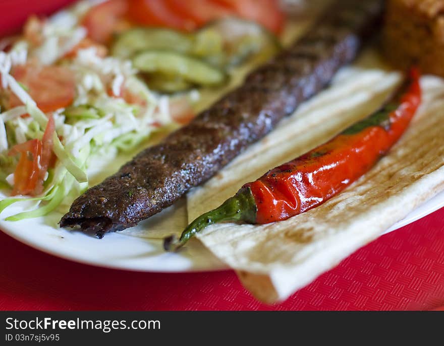 Traditional turkish Adana kebab served with rice, vegetables and lavash. Traditional turkish Adana kebab served with rice, vegetables and lavash