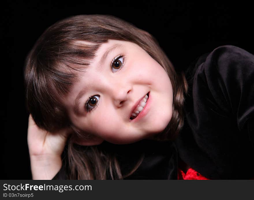 Extreme close-up of happy and adorable little girl. isolated on balck. Extreme close-up of happy and adorable little girl. isolated on balck