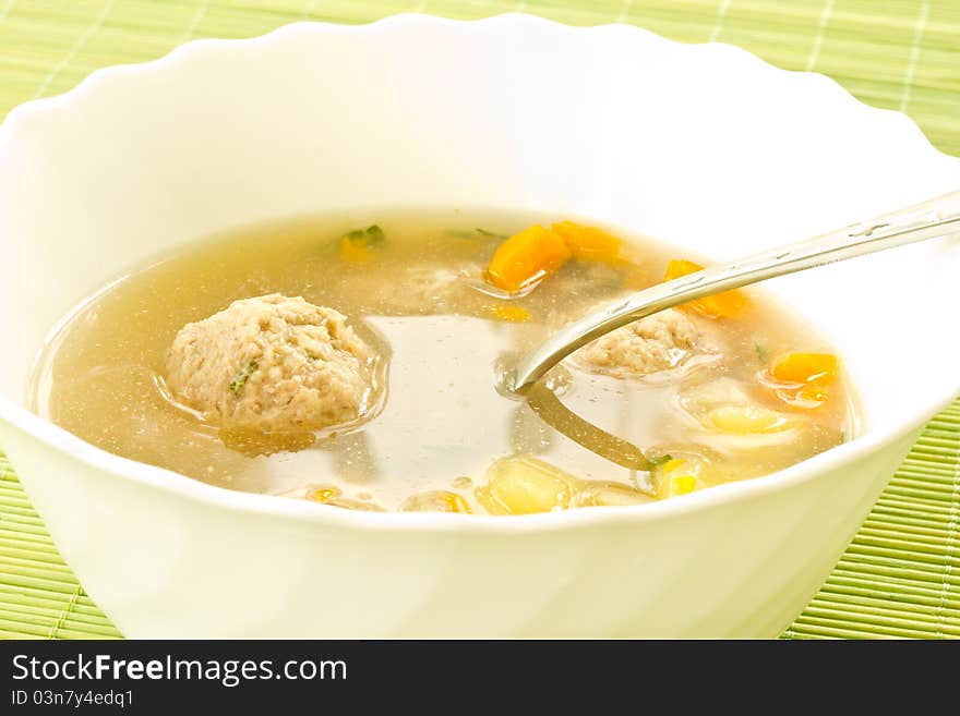 Vegetable soup with meatballs in a plate