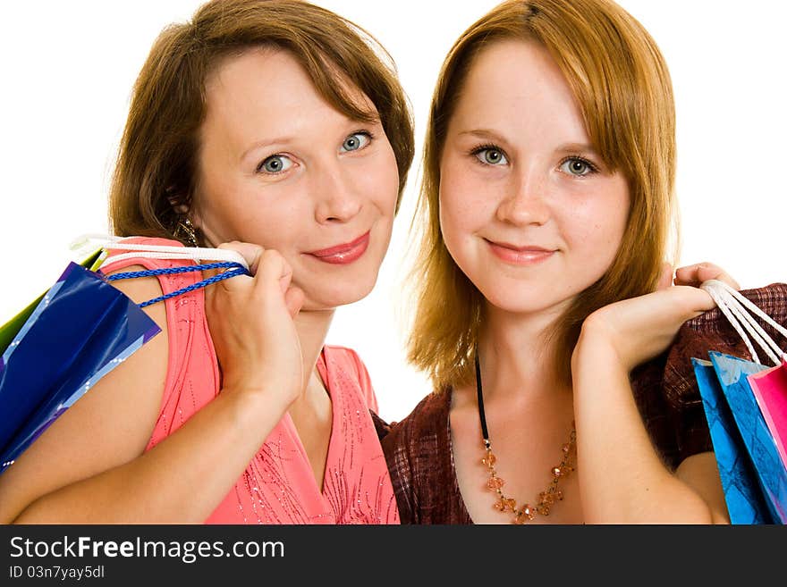 Girls with shopping on white background.