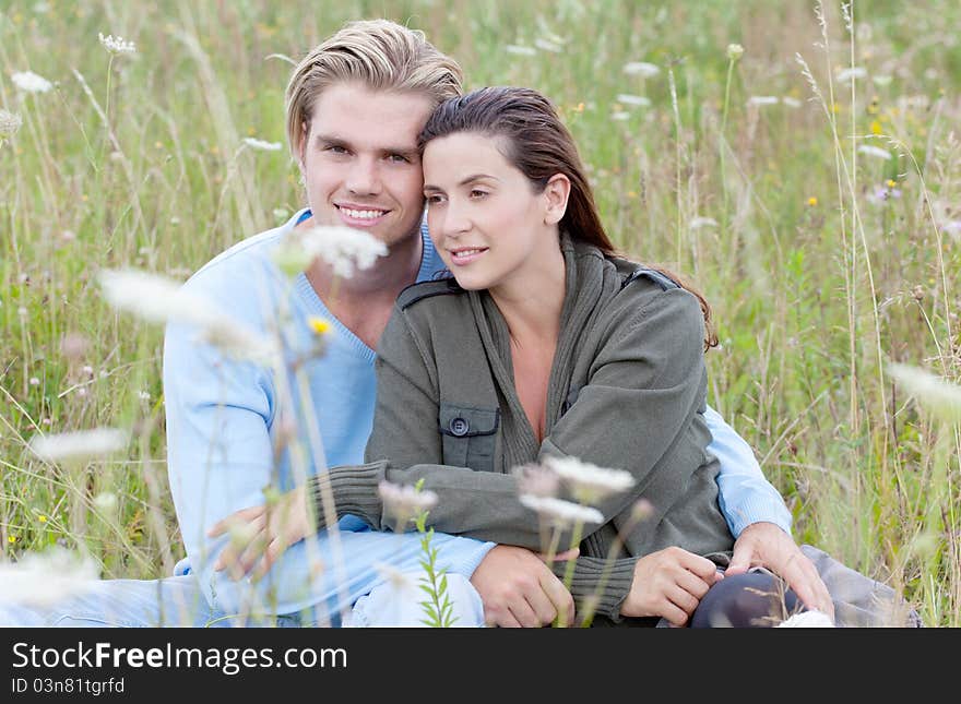 Friendly attractive couple in nature