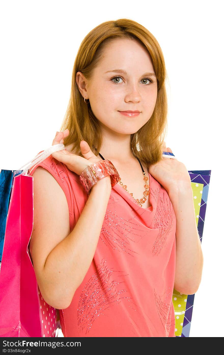 Girl with shopping on white background.