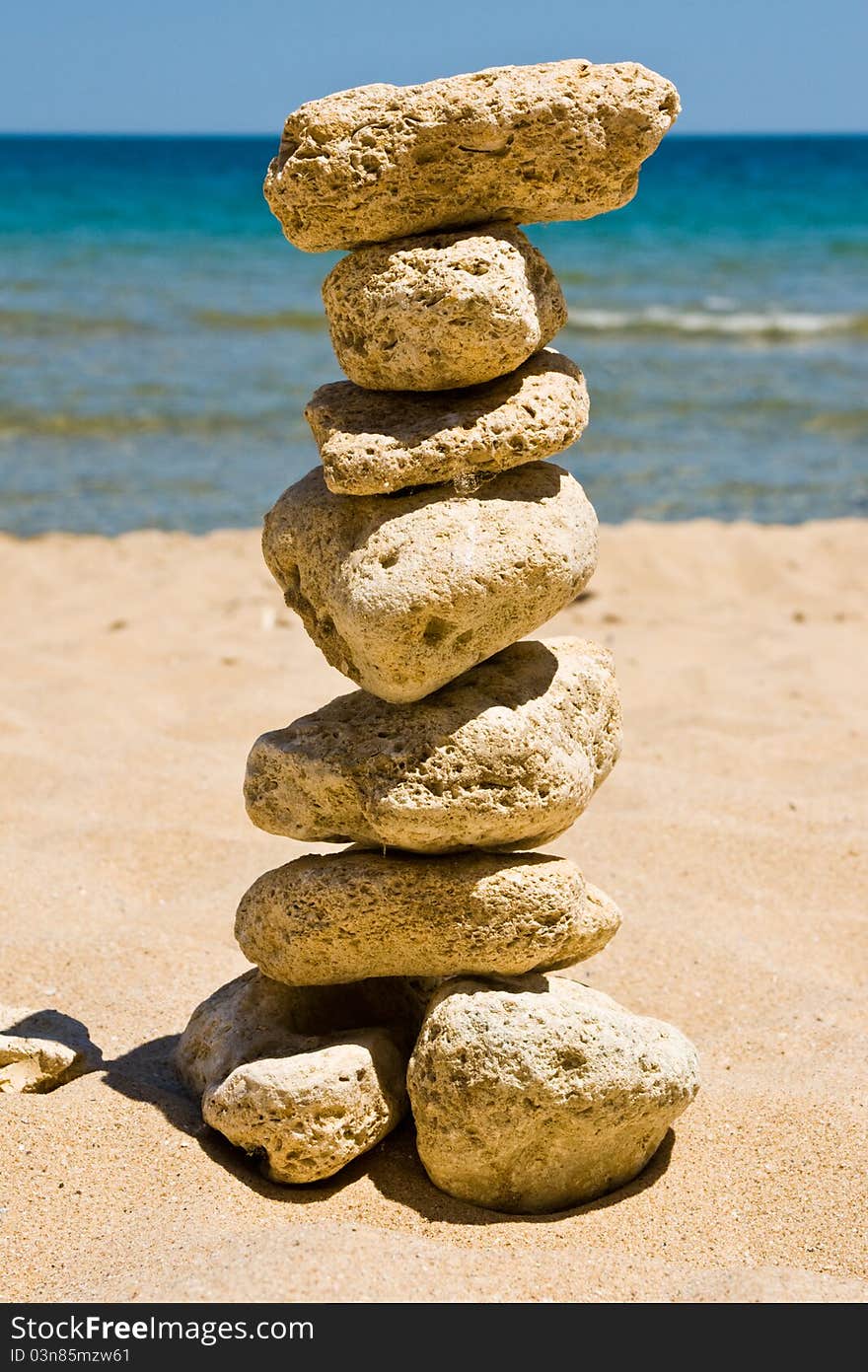 Stack of pebble stones on sea beach