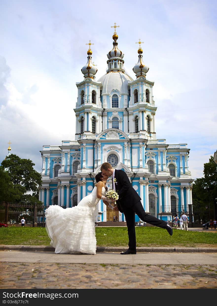 Bride and groom stand and hug. Bride and groom stand and hug