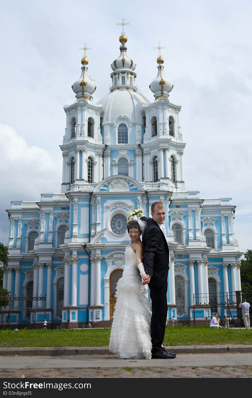 Bride and groom stand and hug. Bride and groom stand and hug