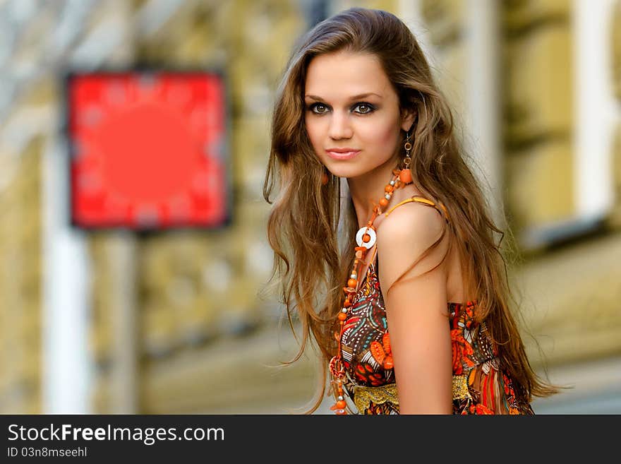 Beautiful girl waiting in the streets