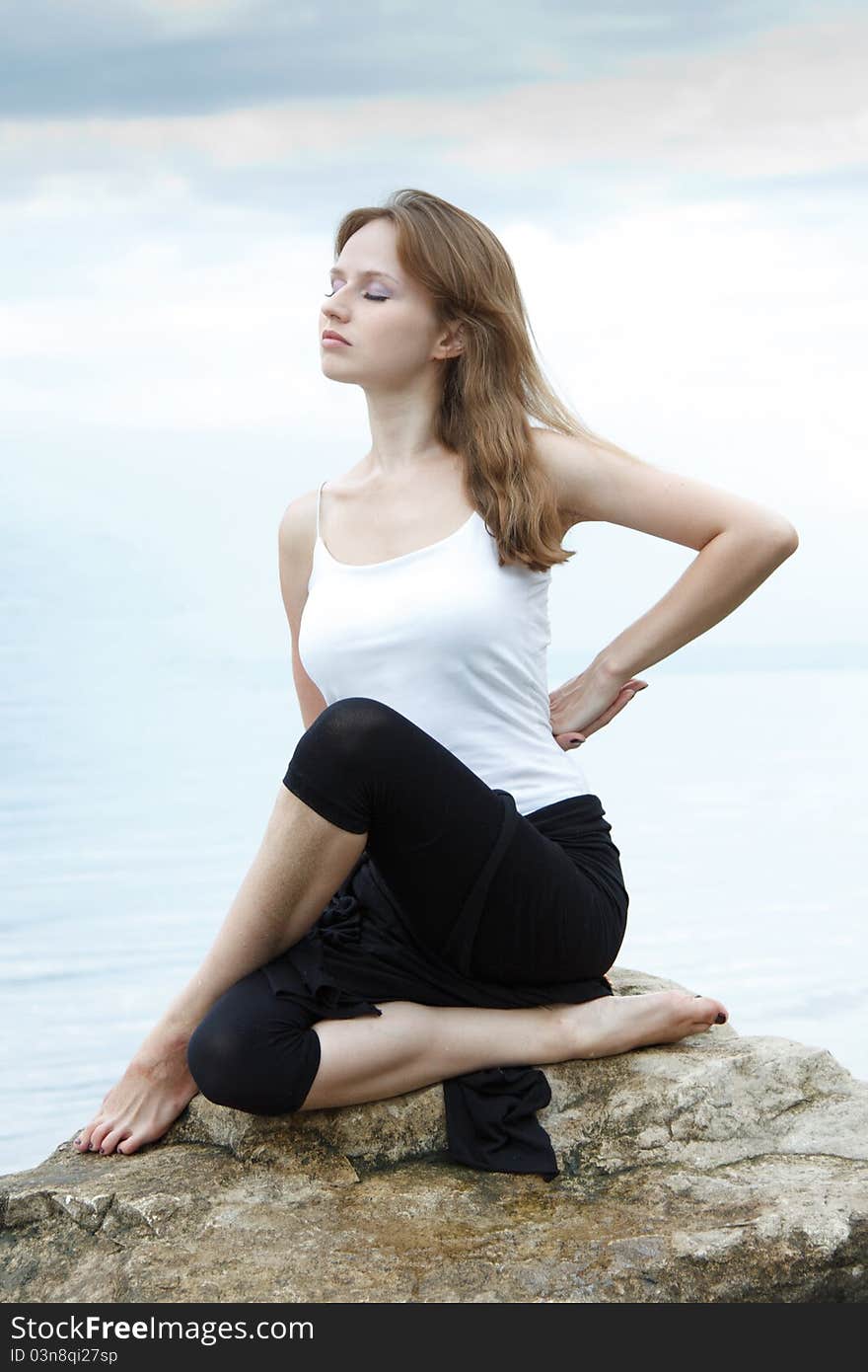 Young woman practicing Yoga exercises. Young woman practicing Yoga exercises.