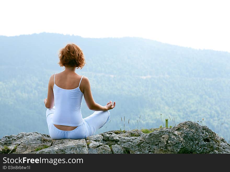 Female gymnastics on the cliff edge. Female gymnastics on the cliff edge