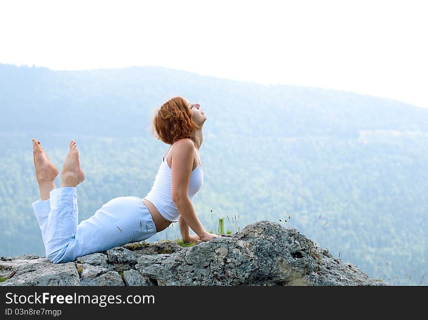 Female gymnastics on the cliff edge. Female gymnastics on the cliff edge