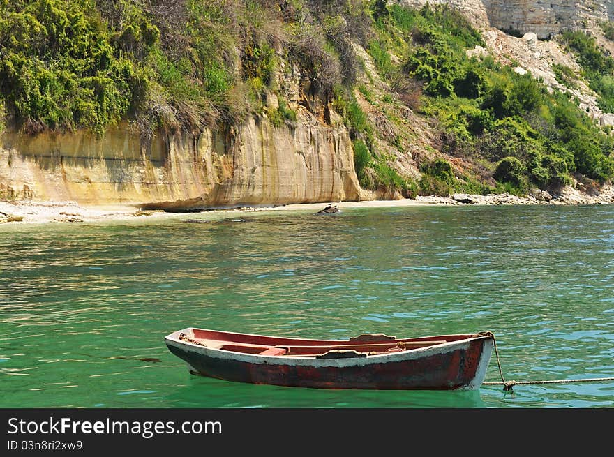 A boat anchored on in the water. A boat anchored on in the water