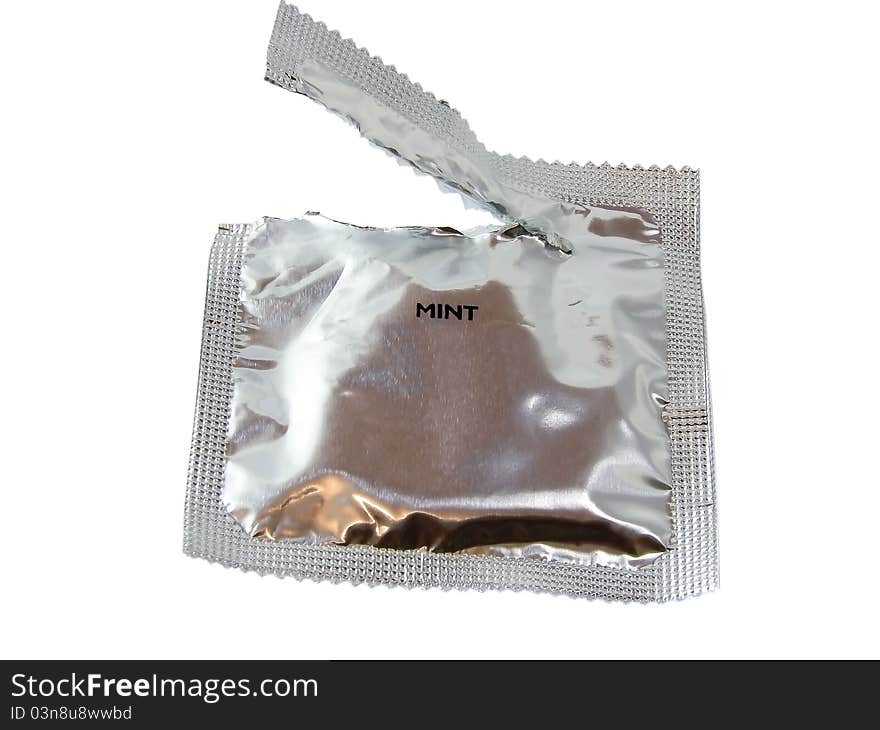 Open pack of condom isolated on white