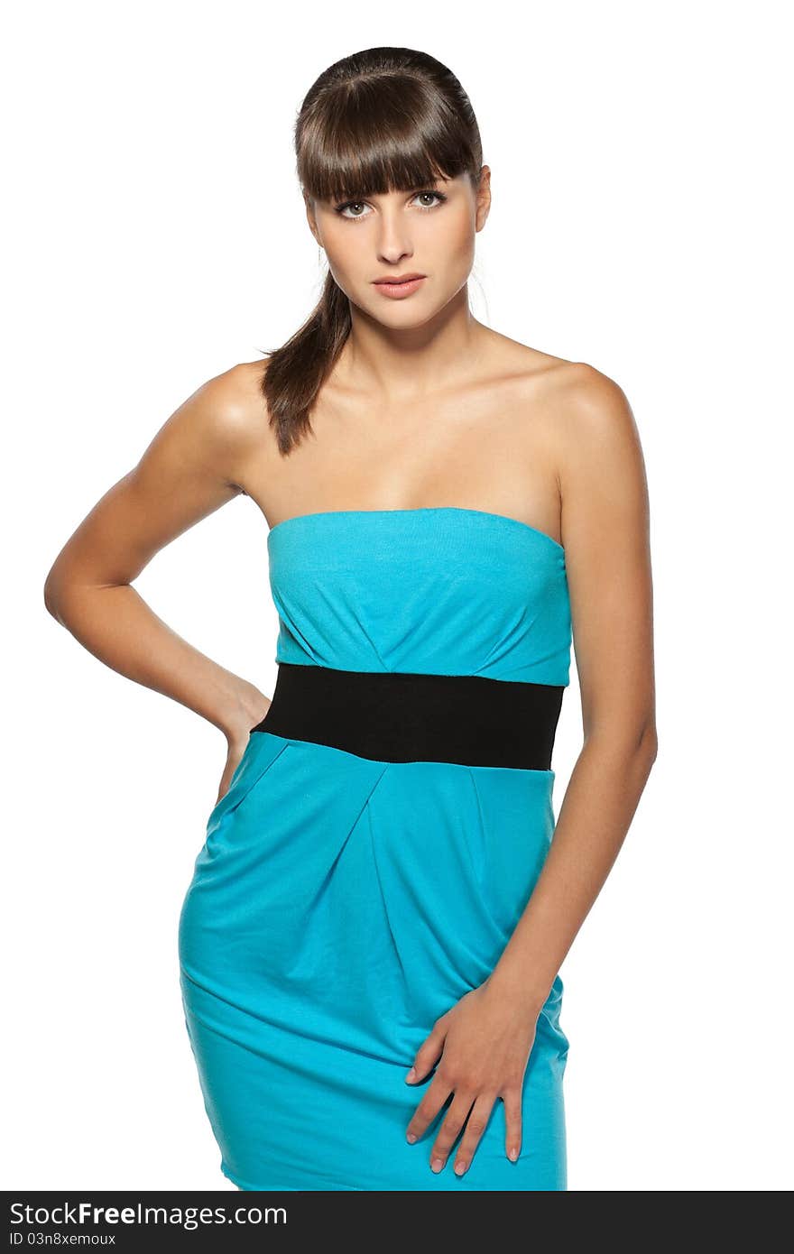 Female model posing in turquoise dress