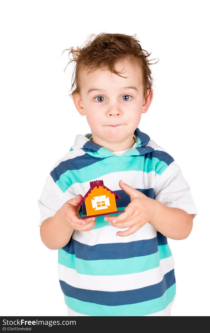 Little boy holding a toy house isolated on white