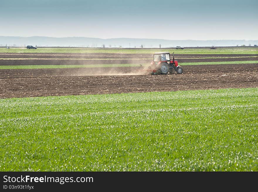 Tractor plowing the fields