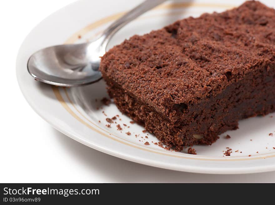 Chocolate dessert and a spoon on a plate