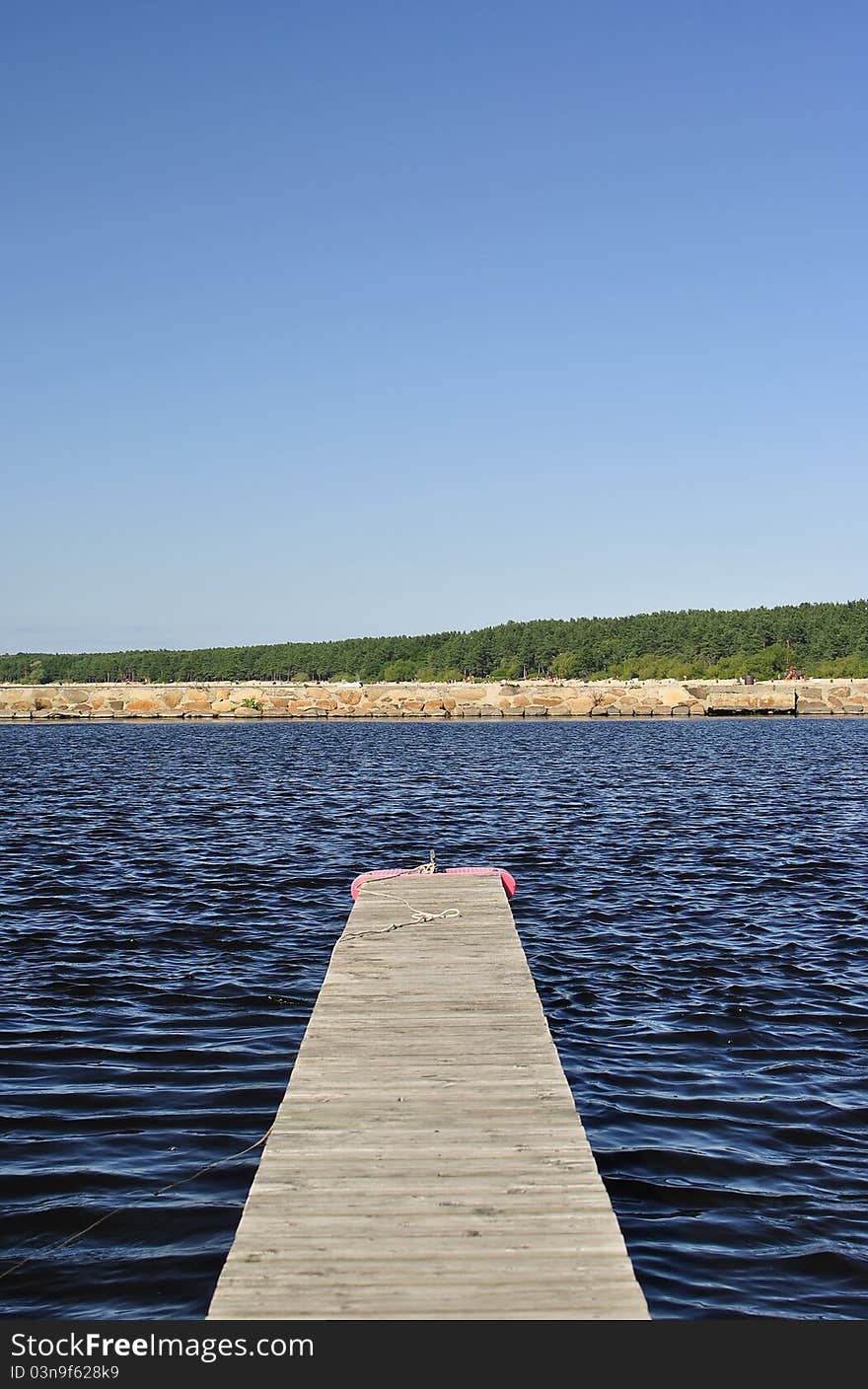 Empty pier against the sea