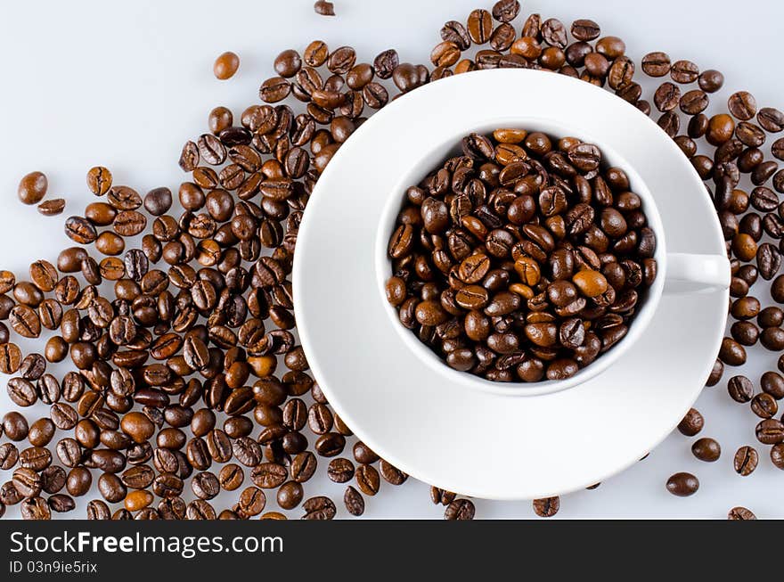 Cup of coffee full with coffee beans. Cup of coffee full with coffee beans