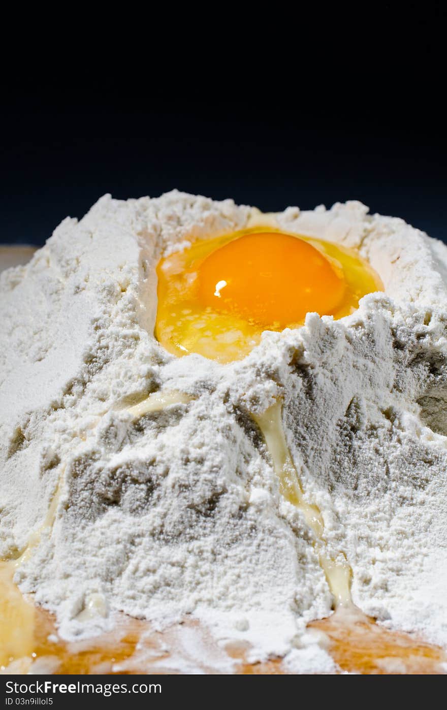 Detail of egg yolk on flour. Detail of egg yolk on flour