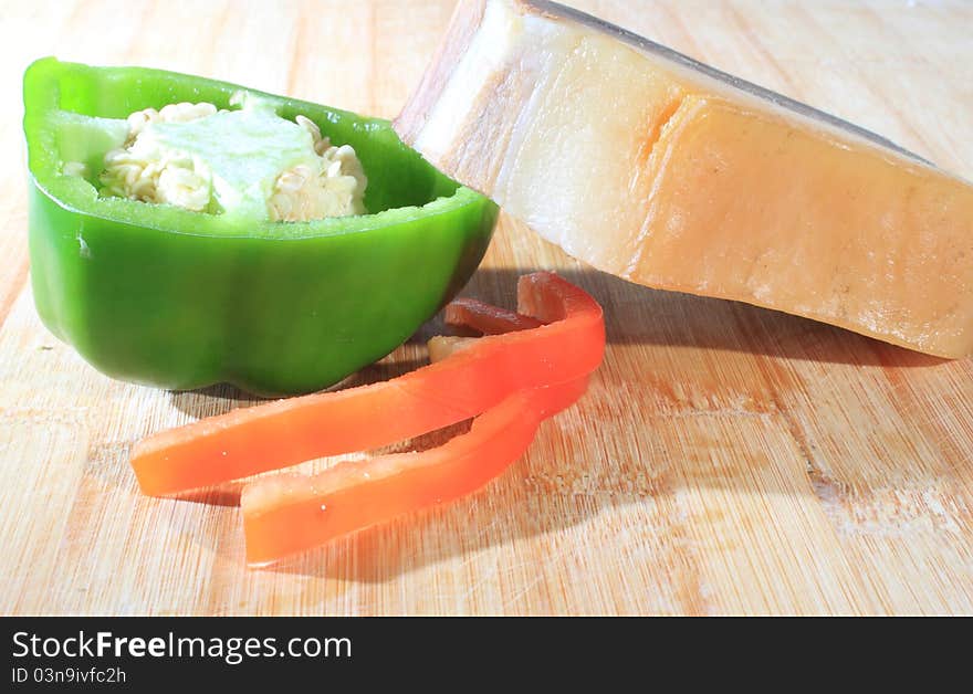 Some meat  and vegetables in the chopping block. Some meat  and vegetables in the chopping block.