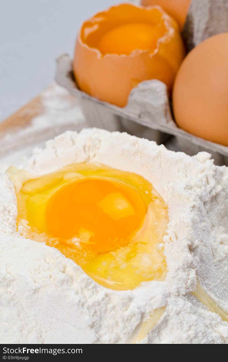 Detail of egg yolk on flour. Detail of egg yolk on flour