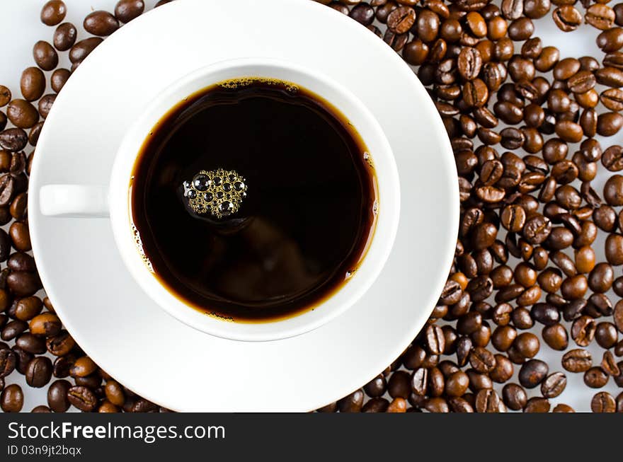 Coffee beans with white cup. Coffee beans with white cup