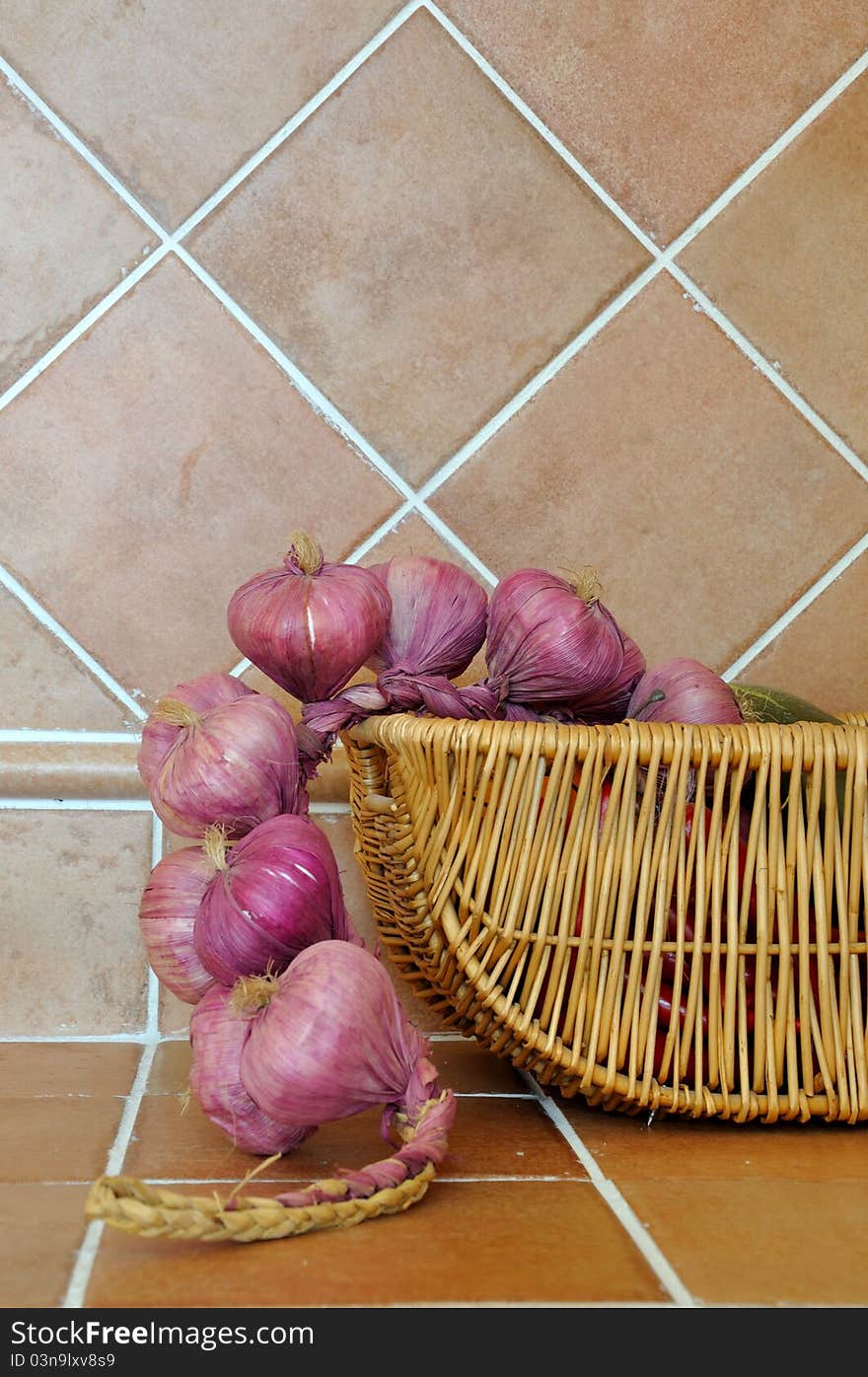 Onion in basket in kitchen, shown as kitchen interior and home life. Onion in basket in kitchen, shown as kitchen interior and home life.