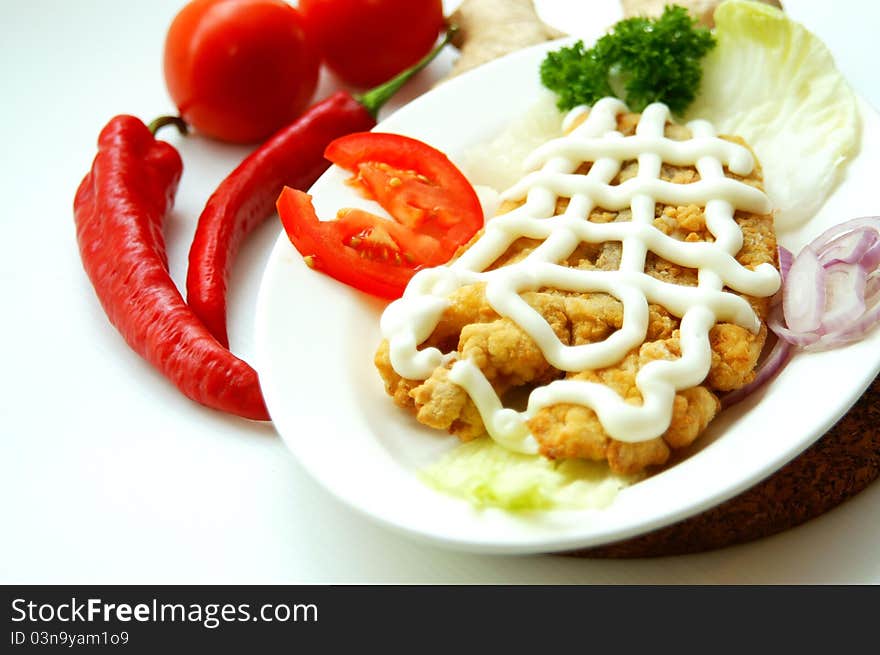 Tasty Chicken Maryland served with mayonnaise tomatoes and onions.