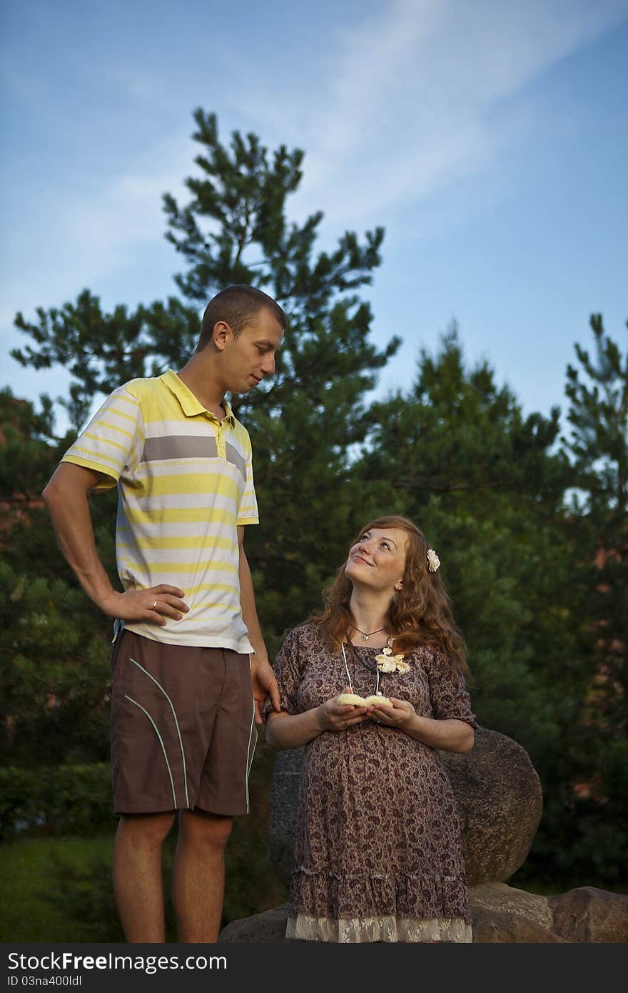 Pregnant girl with a flower