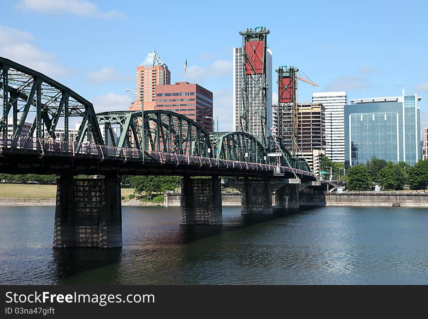 The Hawthorne bridge and Portland OR., skyline.