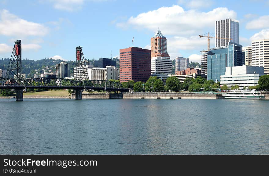 A Portland skyline and the spirit of Portland ship. A Portland skyline and the spirit of Portland ship.