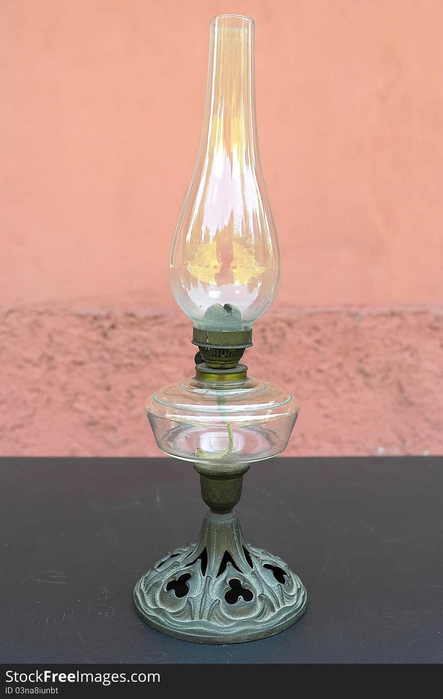 The old kerosene lamp, built on a black table.