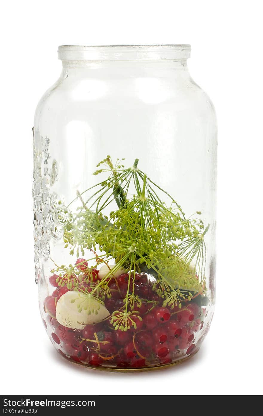 Set for canning cucumbers. In a glass jar are different ingredients for the marinade canning cucumbers. On a white background. Set for canning cucumbers. In a glass jar are different ingredients for the marinade canning cucumbers. On a white background.