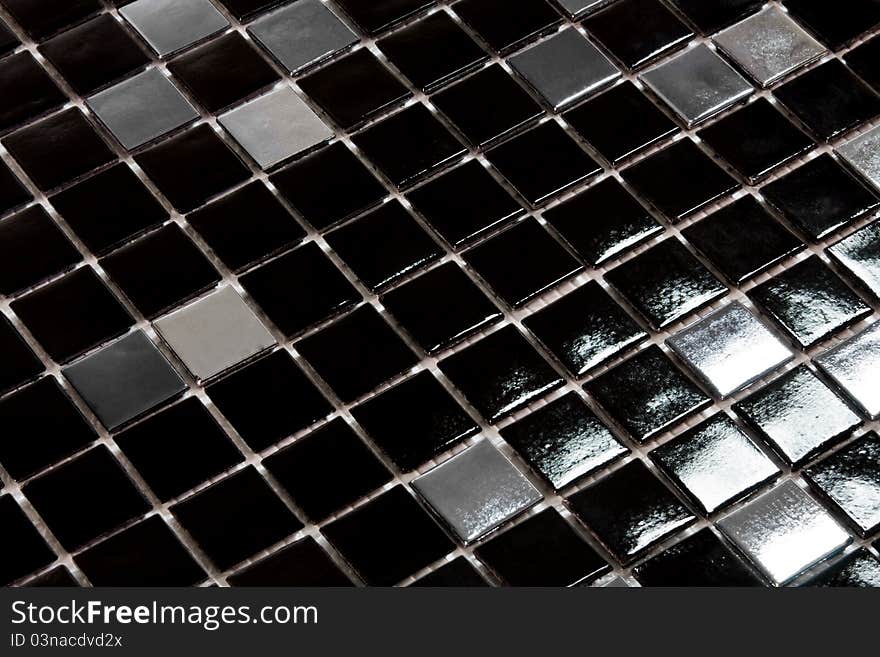 Small black and silver glazed tiles