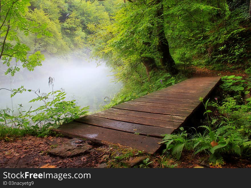 Misty morning and wooden bridge at Kamačnik,Croatia