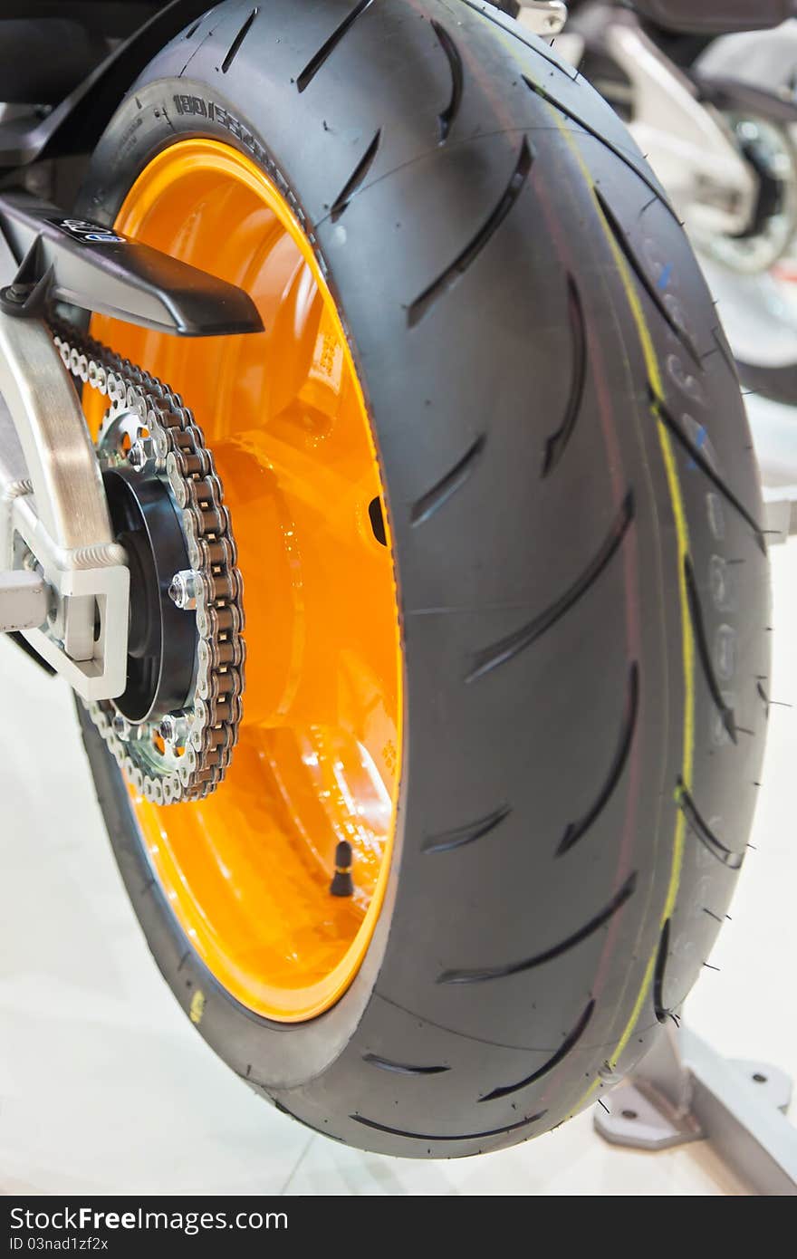 Image of a sports bike wheels with details. Image of a sports bike wheels with details.