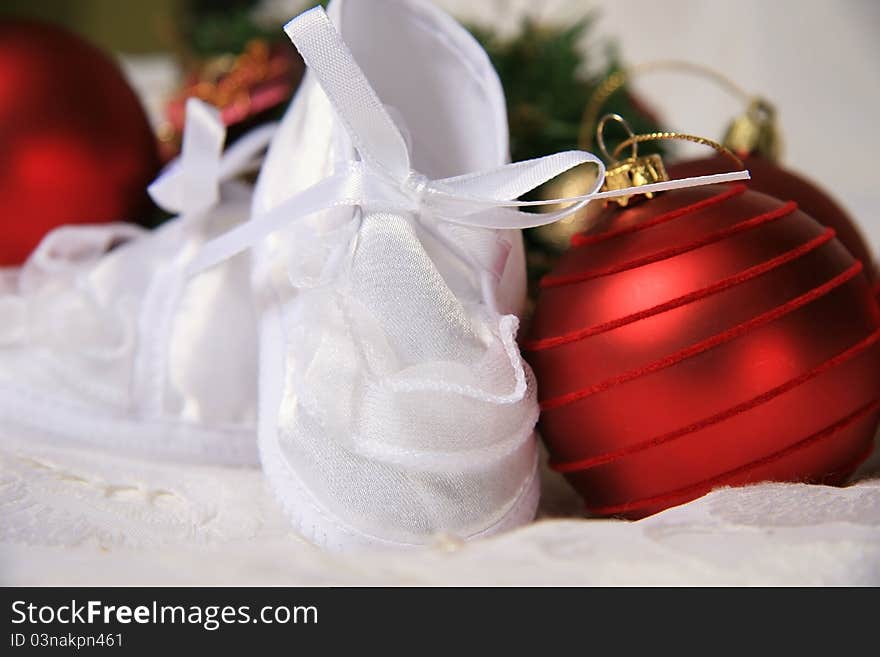 White shoes of a small child on a white background. White shoes of a small child on a white background