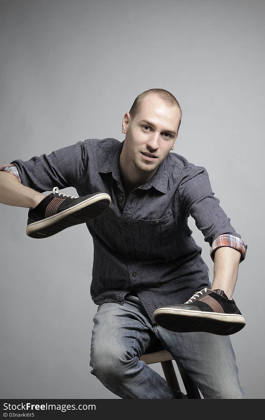 Businessman fighting with sneakers