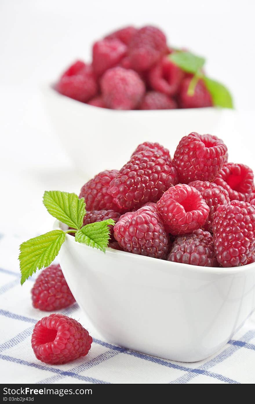 Raspberries In A White Bowl