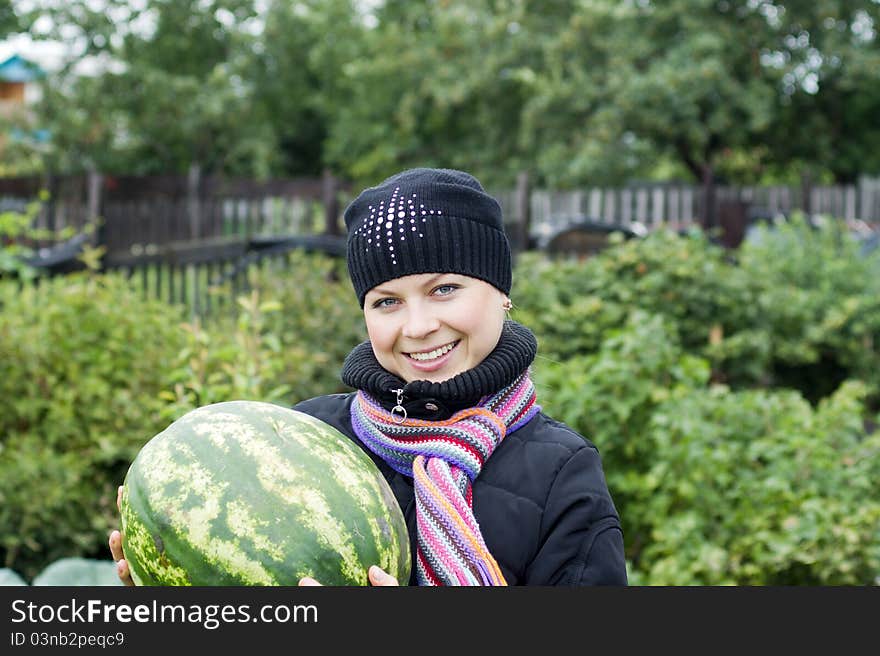 Beautiful woman smiling while holding watermelon. Beautiful woman smiling while holding watermelon