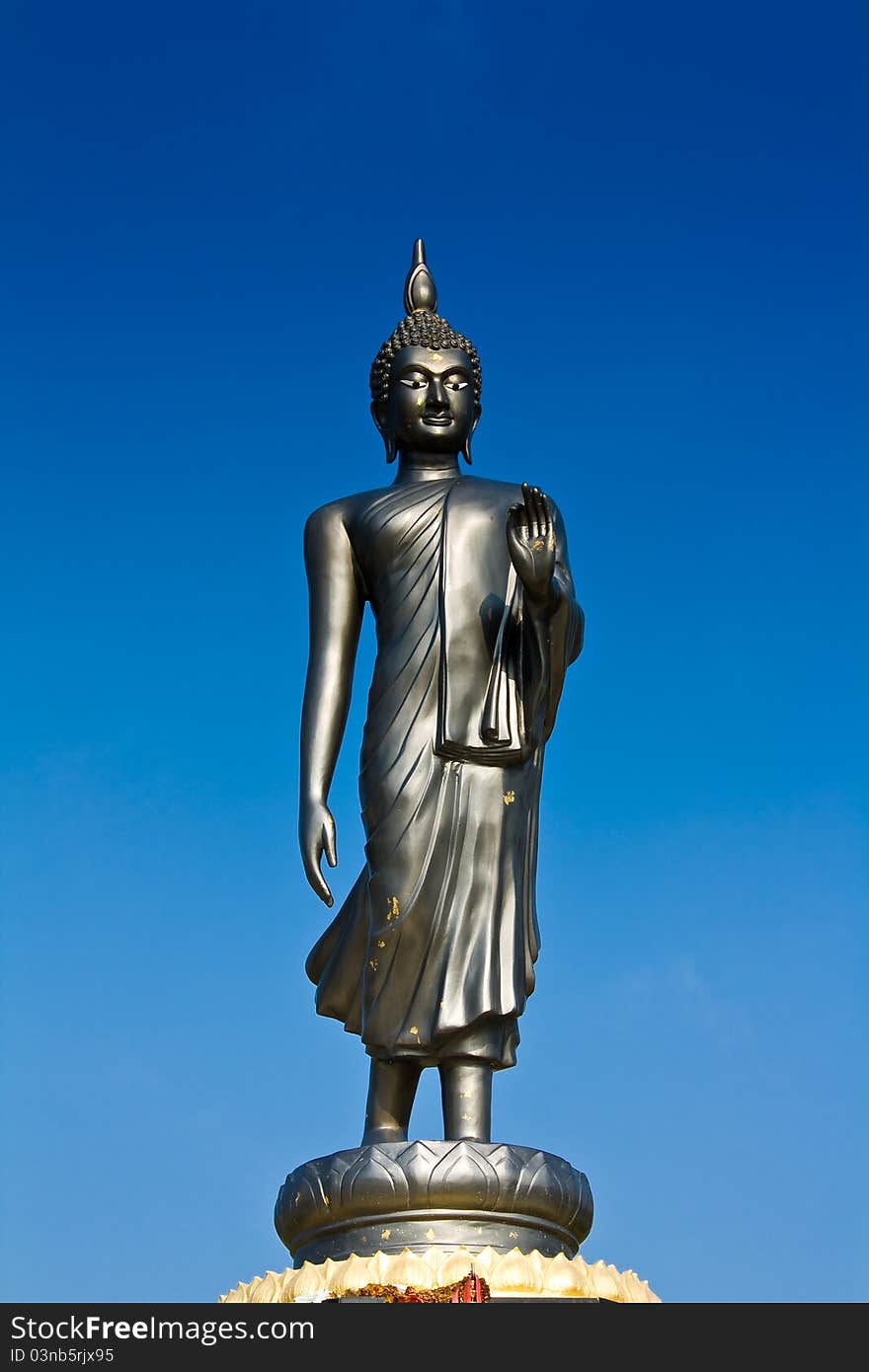 Life style Buddha statue in blue sky made from metal