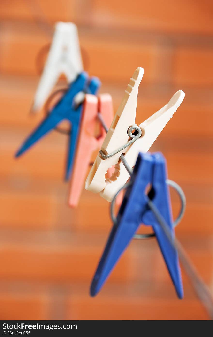 Colorful clothespin hanging on a clothesline