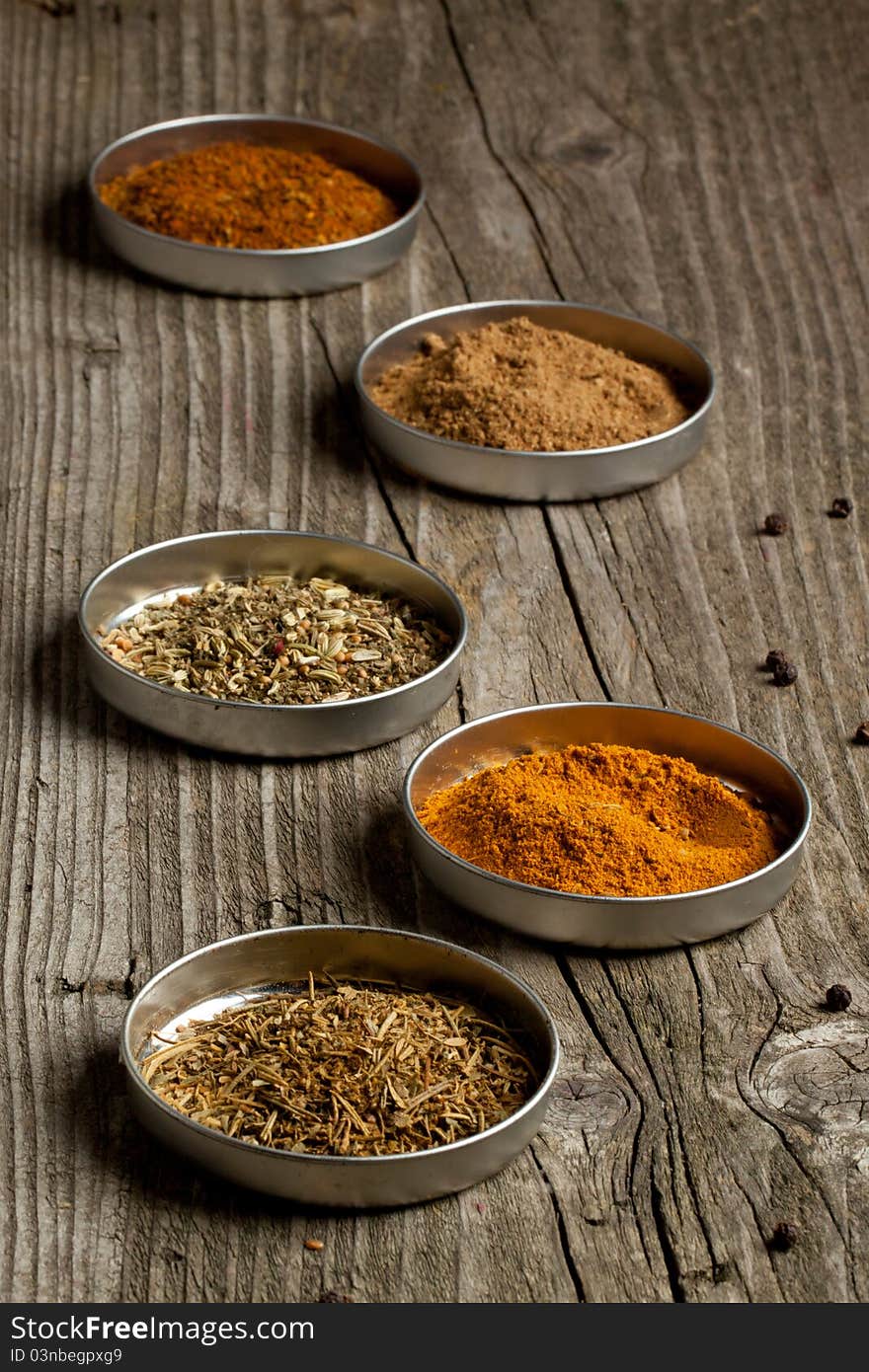 Set of the spices on old wooden table