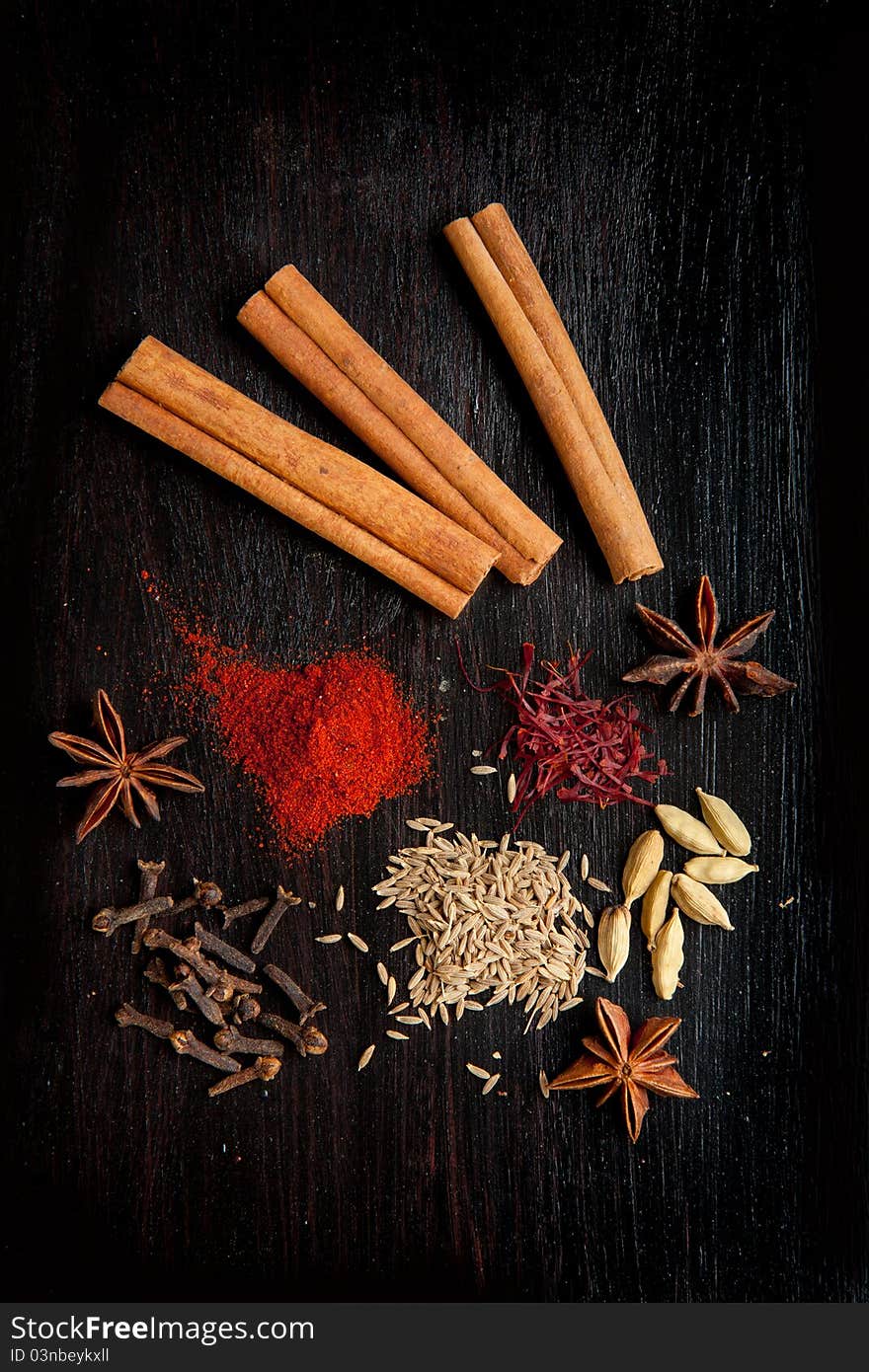 Top view on mix of the spices on the black table