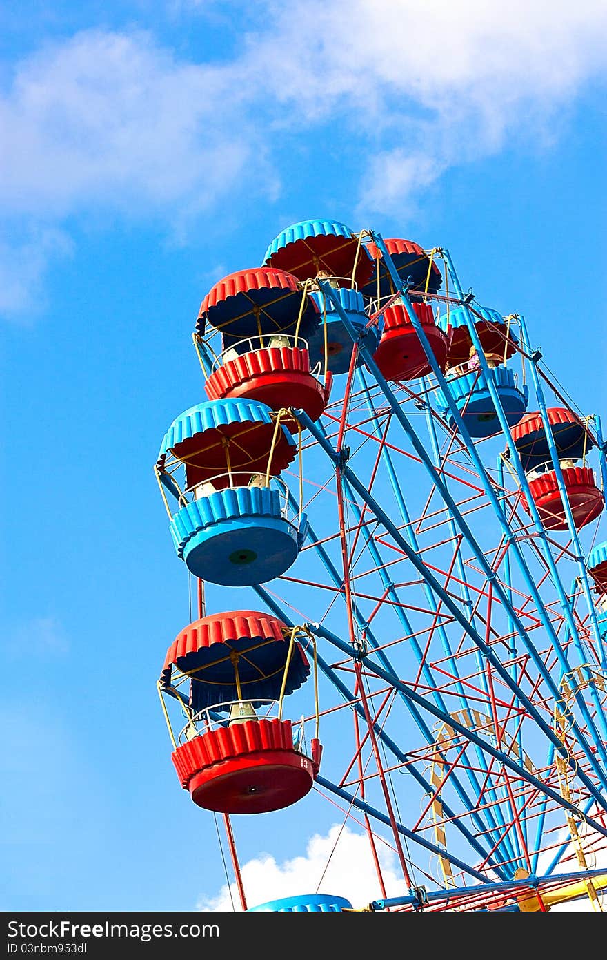 Ferris Wheel over blue sky