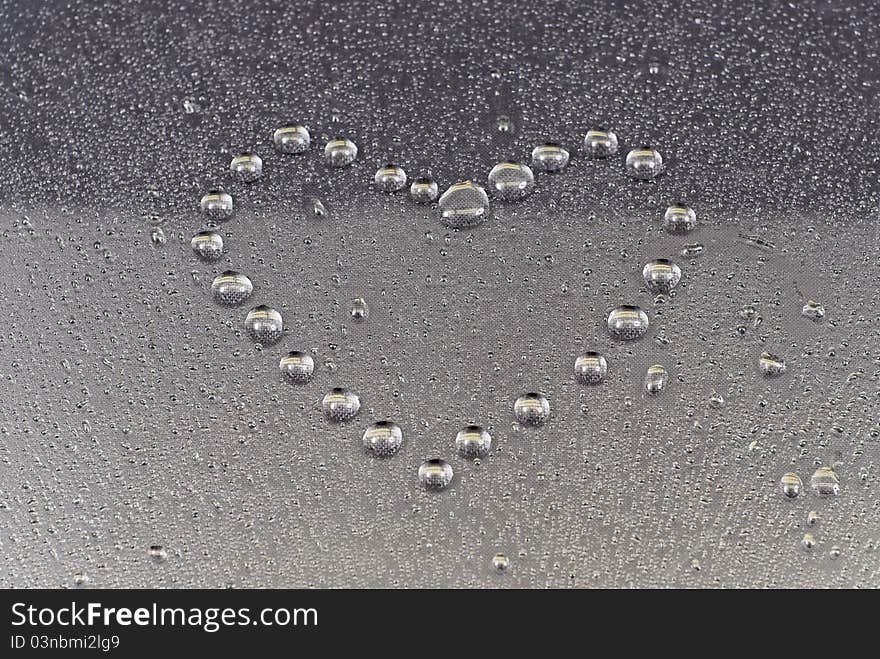 Water Drops Formed Into Heart Shape On Condensation. Water Drops Formed Into Heart Shape On Condensation