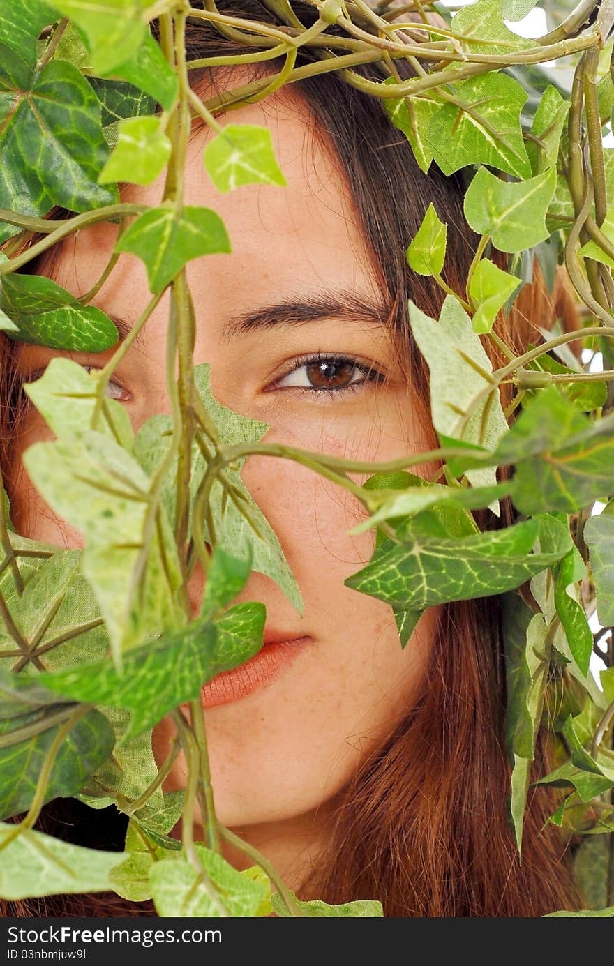 Girl Hiding Behind Ivy Leaves