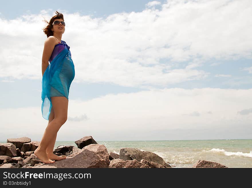 Young Pregnant Woman On Sea Coast