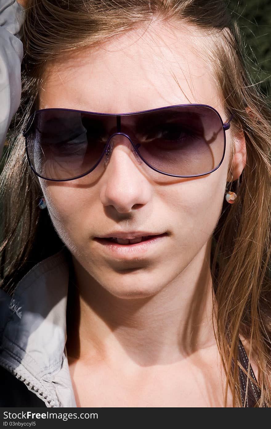 woman with sunglasses and long brown hair