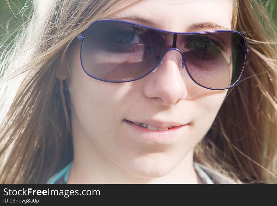 Sexy woman with sunglasses and long brown hair