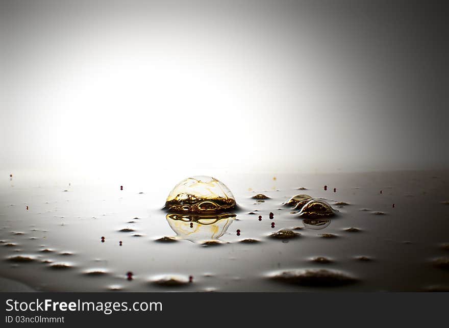 Bubbles and droplets on white surface